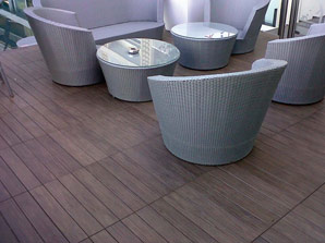 Balcony flooring made with porcelain deck tiles, wood imitation, and built by Urban Balcony.